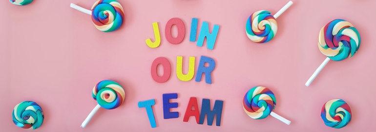 A vibrant pink banner with lollipops, with uppercase letters that read Join Our Team in the middle in colourful fonts