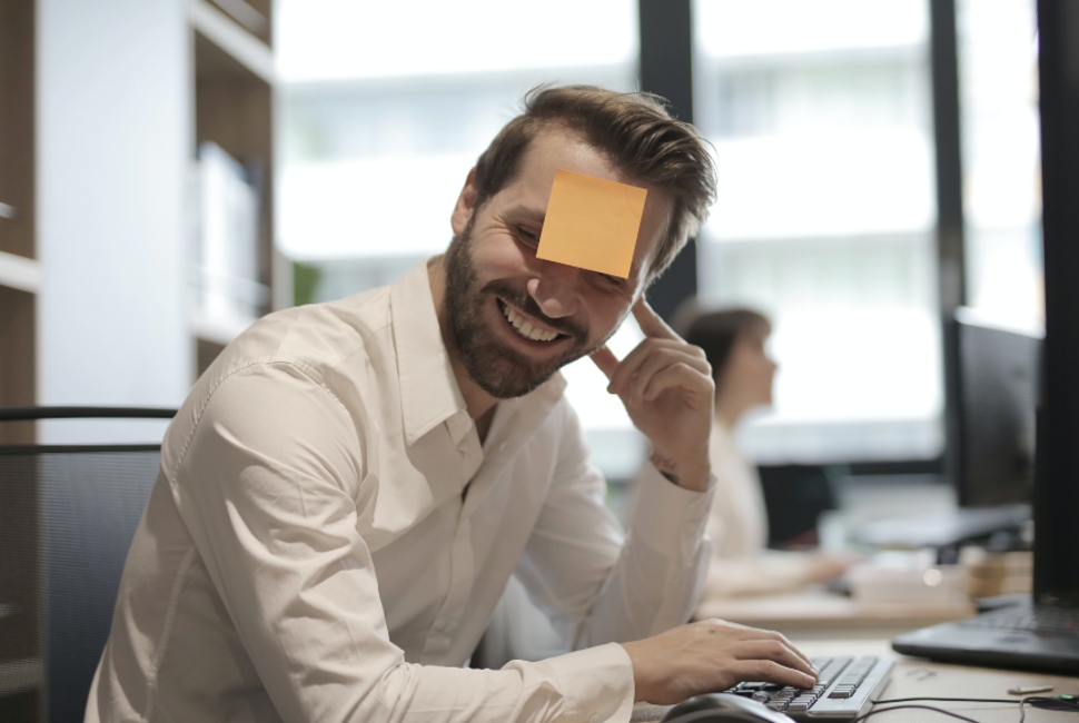man with post it note on his face