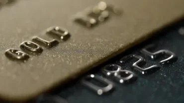  Multiple credit cards arranged side by side, highlighting their unique patterns and branding.